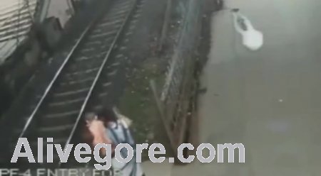Woman Lays In Front Of Train With Child
