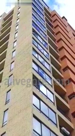 Guy Jumps from the 15th Floor Landing on the Grass