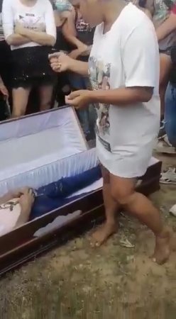 Woman Dancing At Funeral