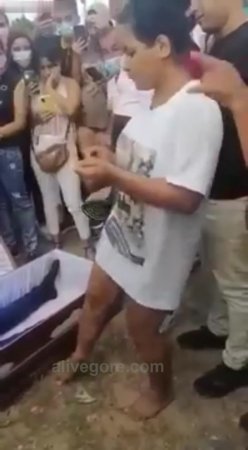 Disgusting Bitch Gives a Disrespectful Goodbye Dance to Bloke in Coffin