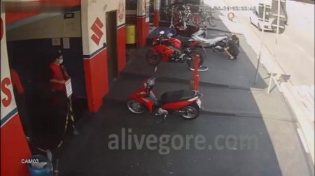2 Guys Working on a Moto Scooter Taken Out by Crashing Biker