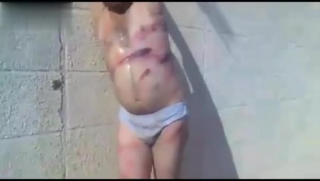 Syrian Rebels Torturing Civilian for Being an Alawite