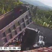 Standing Under a Raised Bed of a Dump Truck Goes Wrong