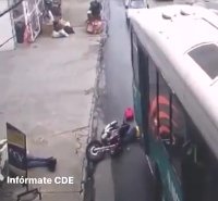 The Passenger Of The Fallen Motorcycle Did Not Have Time To Remove His Head From Under The Wheels Of The Bus