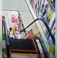 The Girl Got Her Head Between The Escalator And The Wall