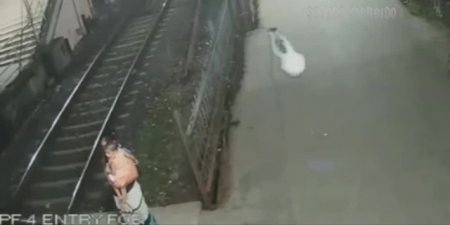 A Woman With A Child In Her Arms Lay Down Under The Train