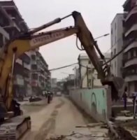 A Concrete Fence Collapsed By An Excavator Crushed A Motorcyclist