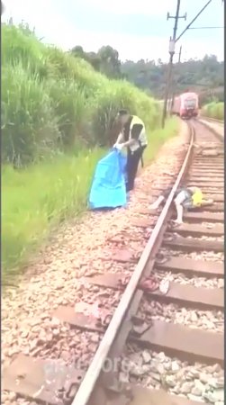 The Dismembered And Mutilated Body Of A Man On The Railroad Tracks