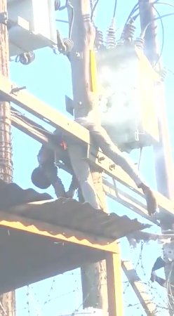 Dead Dude Burns Out Hanging On Electric Wires