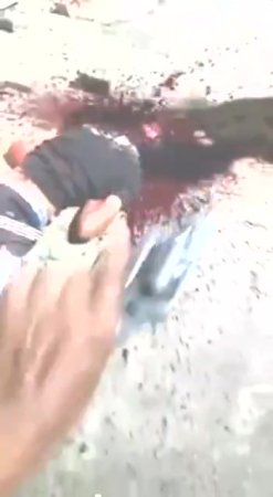 An Unconscious Guy Is Decapitated With A Huge Machete