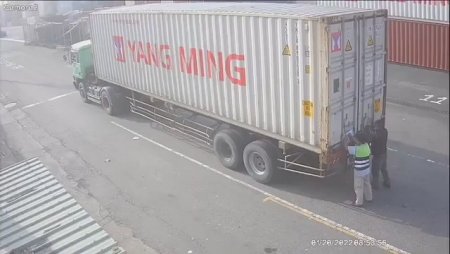The Crashed Truck Flattened The Worker On The Tailgate Of The Truck