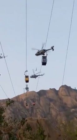A Man Fell From A Helicopter While Lifting Him From A Stopped Funicular