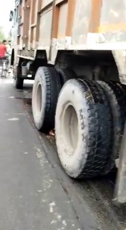 A Man Smeared On The Road By The Tires Of A Truck