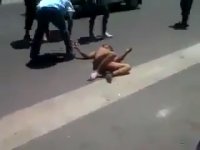 Naked Man Stoned On The Road