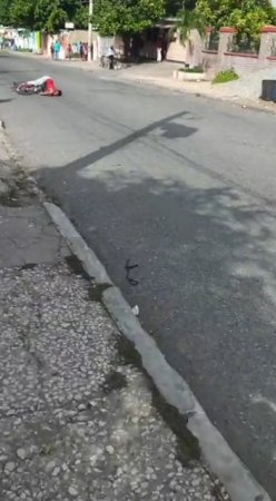 Dead Cyclist On The Road In An Unnatural Position