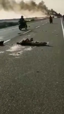 As A Result Of An Accident, The Mutilated Body Of A Woman Lies On The Road