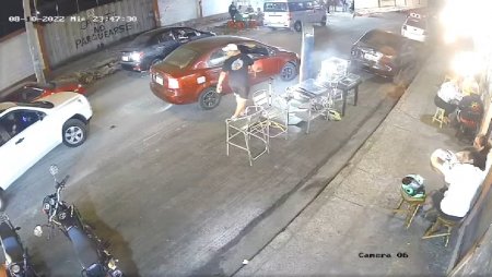 A Man Hiding From A Killer's Bullets Under A Car