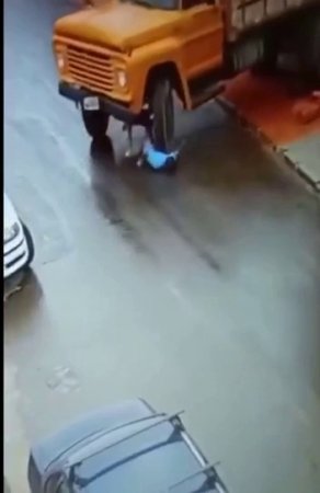 A Driver Tried To Stop A Rolling Truck And Fell Under Its Wheels