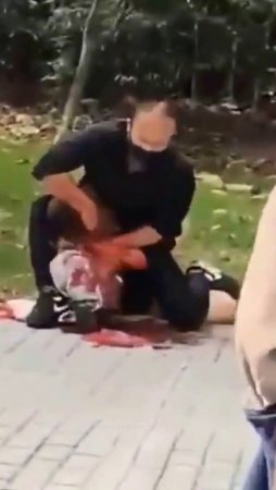 Man Slit A Woman's Throat In The Street. China