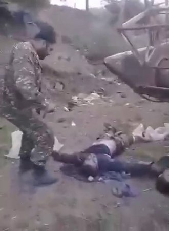 Azerbaijani Soldier Cuts Off Ears Of Dead Armenian Soldiers