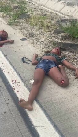 The Broken Bodies Of Those Killed In The Accident Are Scattered On The Road