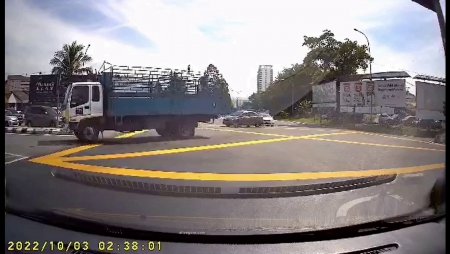 The Impact With The Truck And The Road Divider Left No Chance For The Biker To Survive. Malaysia