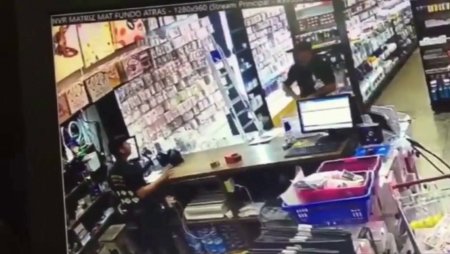 Robber Dies Lying On The Floor After Taking Several Bullets From A Store Clerk