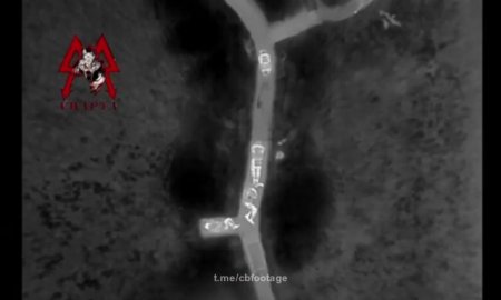Russian drone dropping multiple grenades on Ukrainian soldiers
