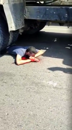 Gawkers Advise A Dude Lying Under The Wheels Of A Truck To Try To Crawl Out From Under It
