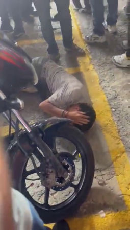 Drunk Motorcyclist Who Caused An Accident Is Kicked By A Crowd Of Men