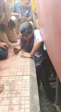 A Woman Squeezed Between The Platform And The Train. India