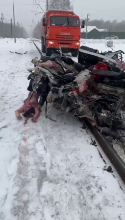 A Truck Drags A Car Hit By A Train With The Bodies Of The Dead Inside. Russia