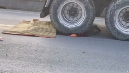 Motorcyclist Fell Under The Wheels Of A Dump Truck. Vietnam