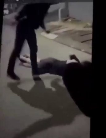 A Woman Lying On The Road Is Kicked To Death