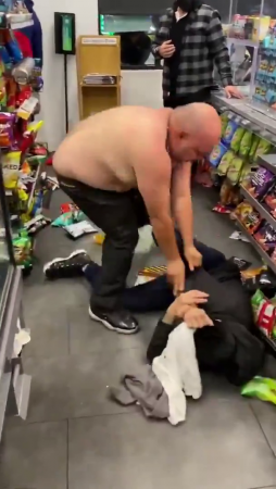 Two Men Fighting At A Gas Station