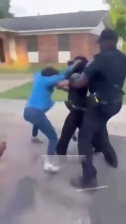 Wigs Fly As A Woman Attacks A Female Police Officer Following An Arrest. Natchez, Miss