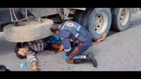 Paramedics Helping A Man With His Legs Crushed By A Truck