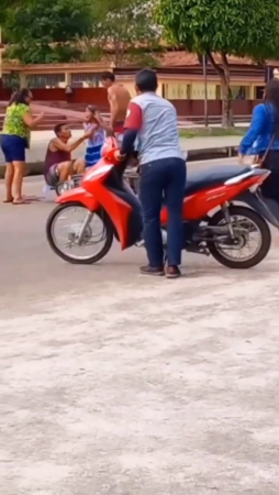 A Jerk Jumping On The Road Knocked Down A Married Couple On A Motorcycle