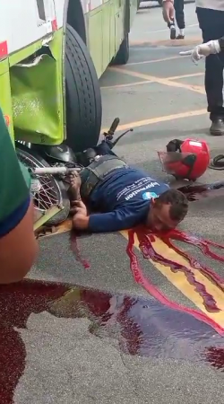 When Trying To Overtake The Motorcyclist Fell Under The Wheels Of The Bus And Was Crushed