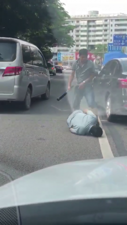 A Driver With A Bat In His Hands Wins In A Road Conflict
