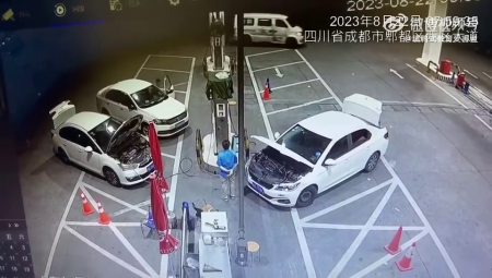 Worker dodges fire that erupts from car engine while refuelling. China