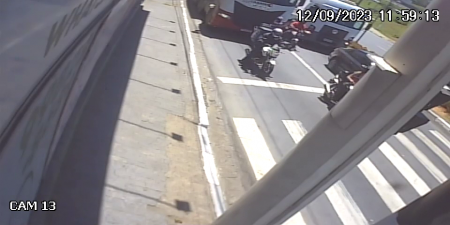 A Pedestrian Stopped Unsuccessfully In A Truck's Blind Spot To Exchange A Few Words With A Motorcyclist