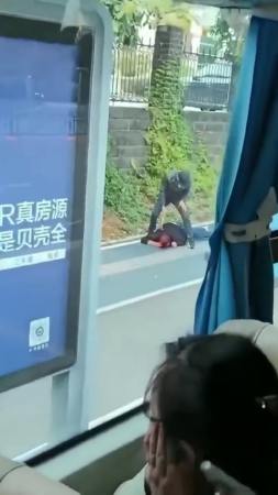 Dude Hits The Head Of A Man Lying On The Road With A Hammer