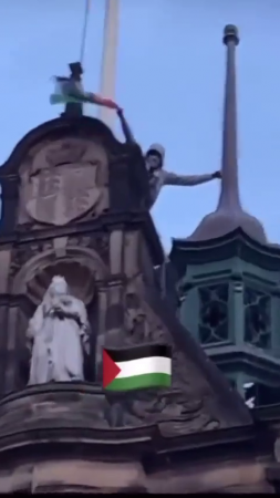 A Pro-Palestine Protester Tears Down An Israeli Flag From City Hall. Sheffield, UK