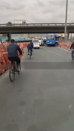 A Gang Of Cyclists Robs Private And Public Transport. Bogota, Colombia
