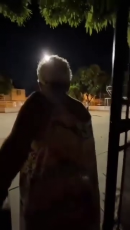An Elderly Woman Shoots Men Playing Basketball With Fireworks