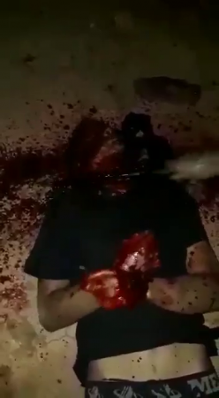 A Man With His Hands Tied Gets His Head Cut Off With A Hammer And An Ax