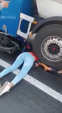 A Pregnant Woman Fell From A Motorcycle Under The Wheels Of A Truck. Aftermath