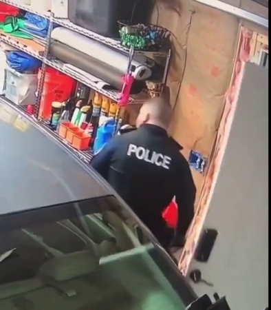 A Policeman Deliberately Opens The Door Wide To Damage A Car Parked In The Garage