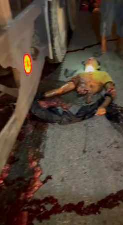 Body Parts Of A Crushed Man Are Taken Out From Under A Truck